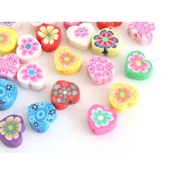 20 perles en pâte polymère - cœurs effet millefiori - multicolore