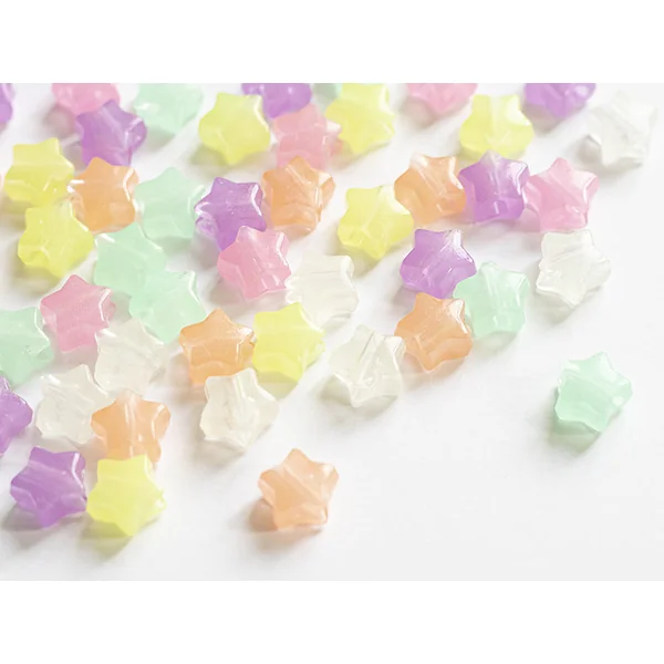 50 perles en plastique - étoiles - phosphorescent / brille dans le noir